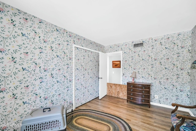 1924 W Belmont Ave, Phoenix, AZ 85021 - bedroom featuring wallpapered walls and wood finished floors