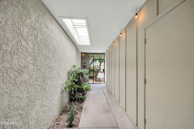 1924 W Belmont Ave, Phoenix, AZ 85021 - hallway with expansive windows, concrete floors, and a skylight