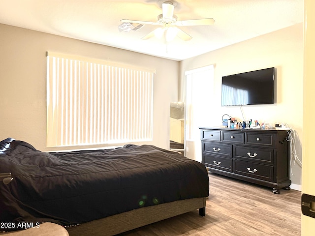 bedroom featuring ceiling fan and light wood-type flooring