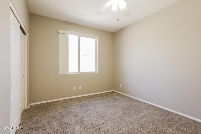 unfurnished bedroom featuring a closet, ceiling fan, and carpet flooring