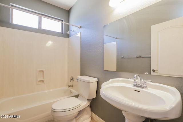 full bathroom featuring bathtub / shower combination, toilet, and sink