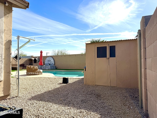 view of yard with a fenced in pool and a patio