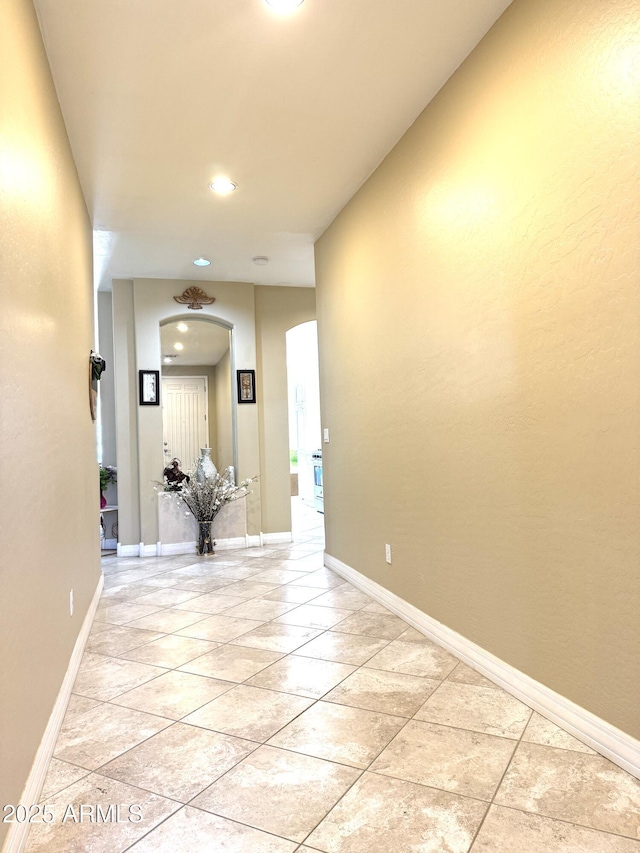 hallway featuring light tile patterned floors