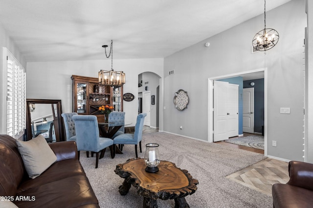 2111 E Rawhide St, Gilbert, AZ 85296 - living area with a chandelier, arched walkways, lofted ceiling, and carpet flooring