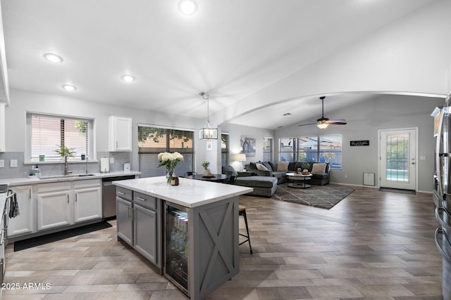 2111 E Rawhide St, Gilbert, AZ 85296 - kitchen featuring wine cooler, ceiling fan, recessed lighting, open floor plan, and tasteful backsplash