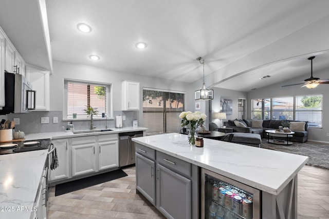2111 E Rawhide St, Gilbert, AZ 85296 - kitchen featuring stainless steel appliances, beverage cooler, recessed lighting, tasteful backsplash, and ceiling fan