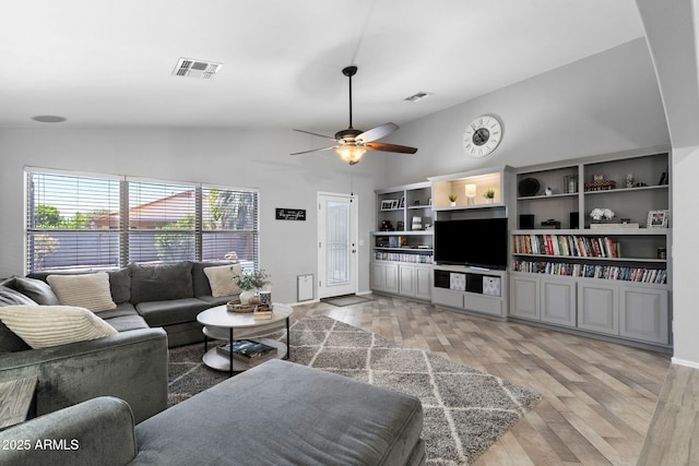 2111 E Rawhide St, Gilbert, AZ 85296 - living room with light wood finished floors, a ceiling fan, and high vaulted ceiling