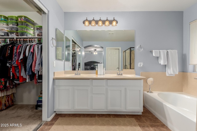 bathroom with plus walk in shower and vanity