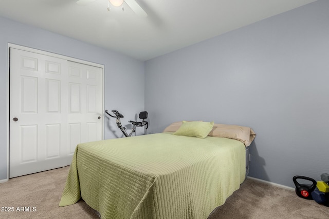 bedroom with carpet, a closet, and ceiling fan