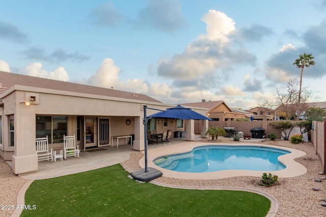 view of swimming pool with a patio area