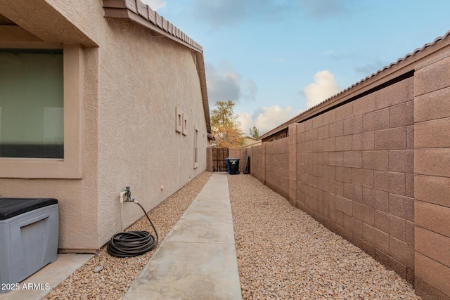 view of side of home featuring a patio