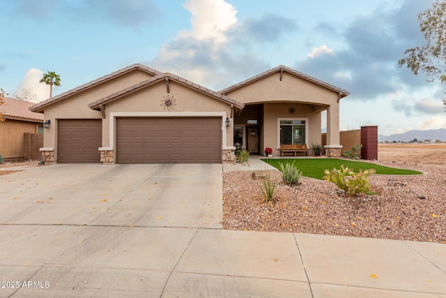 view of front of property featuring a mountain view and a garage