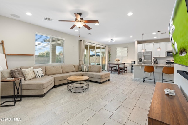 living room with ceiling fan