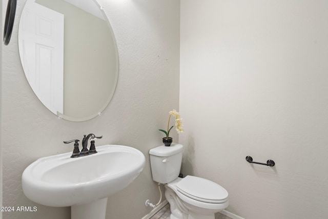 bathroom with sink and toilet