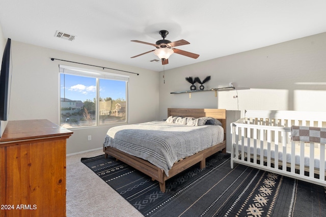 bedroom with ceiling fan and carpet floors