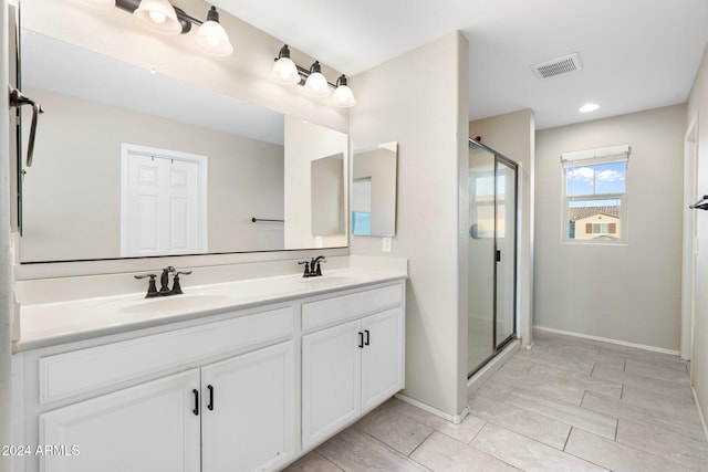 bathroom with vanity and walk in shower