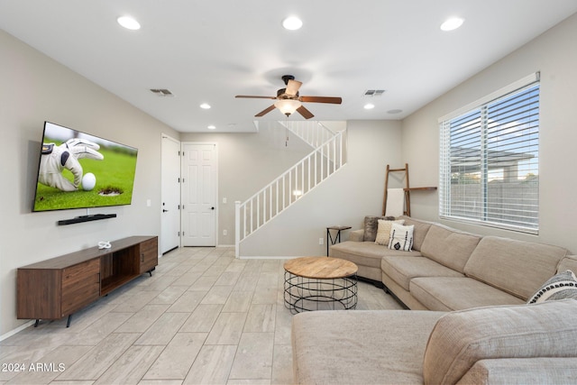 living room featuring ceiling fan