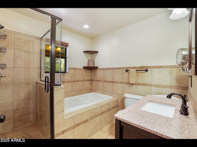 6869 W Ute Trl, Pine, AZ 85544 - full bath featuring a garden tub, a shower stall, tile patterned floors, vanity, and tile walls