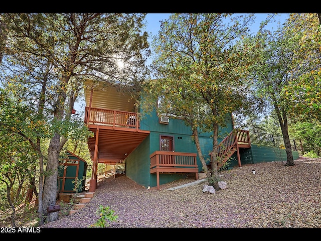 6869 W Ute Trl, Pine, AZ 85544 - rear view of house featuring stairs and a wooden deck