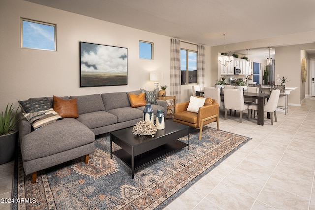 living room with light tile floors and an inviting chandelier