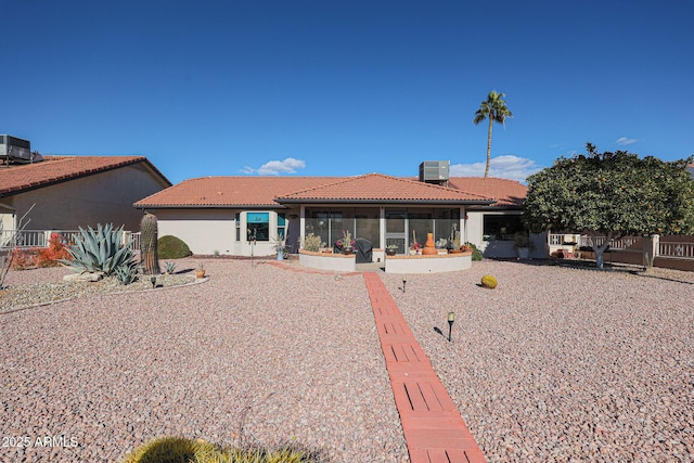 back of house with a sunroom