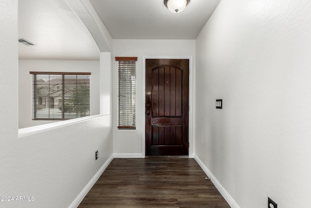 entryway with dark hardwood / wood-style floors