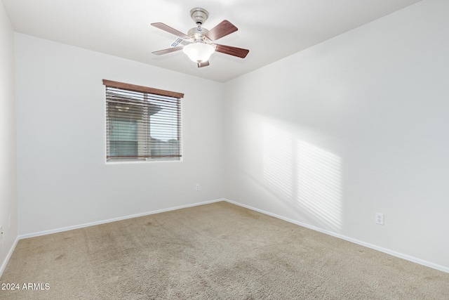 unfurnished room with ceiling fan and carpet floors