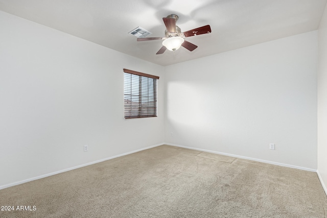 spare room featuring carpet flooring and ceiling fan