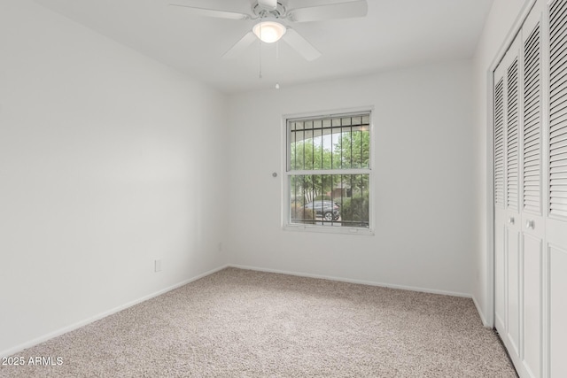 1515 N Saguaro Dr, Tempe, AZ 85288 - unfurnished bedroom with carpet, a closet, baseboards, and ceiling fan
