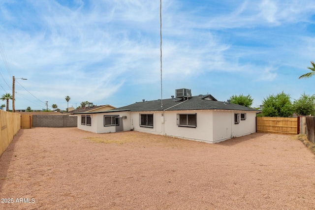1515 N Saguaro Dr, Tempe, AZ 85288 - rear view of property featuring a fenced backyard, central AC, and stucco siding