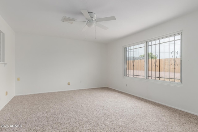 1515 N Saguaro Dr, Tempe, AZ 85288 - spare room featuring carpet flooring, a ceiling fan, and baseboards