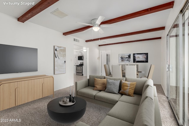 1515 N Saguaro Dr, Tempe, AZ 85288 - carpeted living room featuring beamed ceiling and ceiling fan