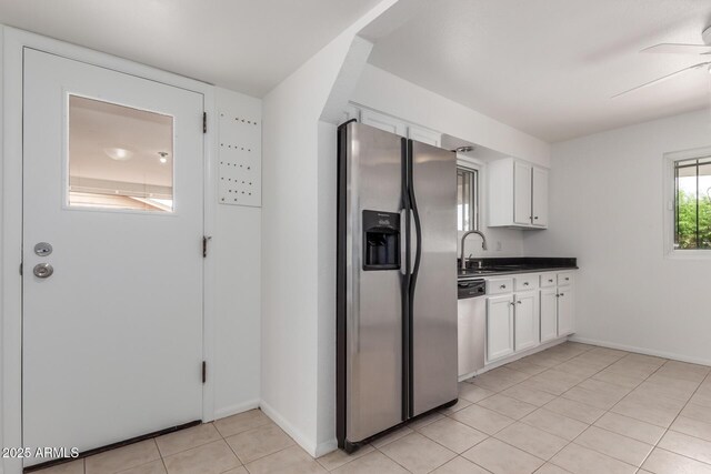 1515 N Saguaro Dr, Tempe, AZ 85288 - kitchen with appliances with stainless steel finishes, white cabinets, ceiling fan, light tile patterned floors, and dark countertops