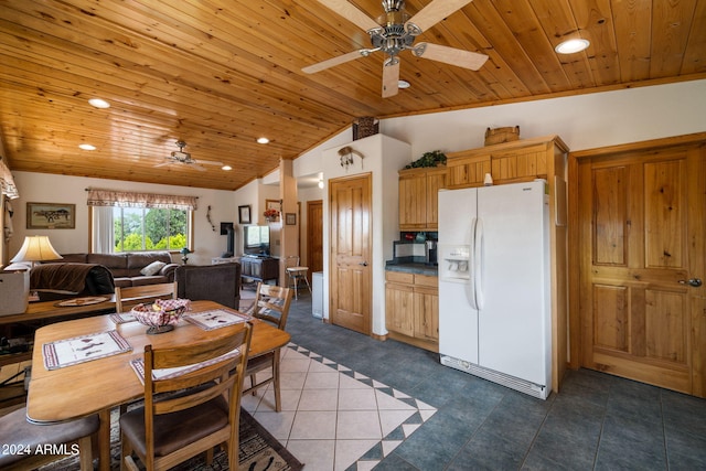 kitchen featuring wood ceiling, white refrigerator with ice dispenser, dark tile patterned flooring, ceiling fan, and vaulted ceiling