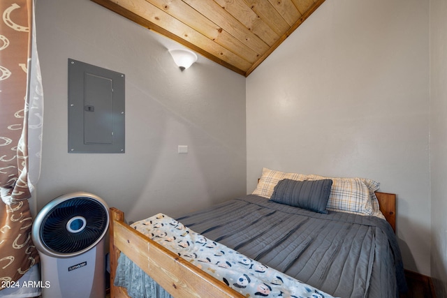 bedroom featuring wood ceiling, lofted ceiling, and electric panel