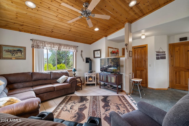 tiled living room featuring wood ceiling, lofted ceiling, a wood stove, and ceiling fan