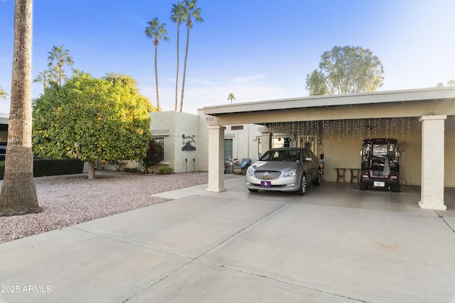 view of parking / parking lot with a carport