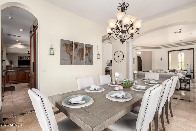 9753 E Suncrest Rd, Scottsdale, AZ 85262 - dining space featuring arched walkways, light tile patterned floors, recessed lighting, and ornate columns
