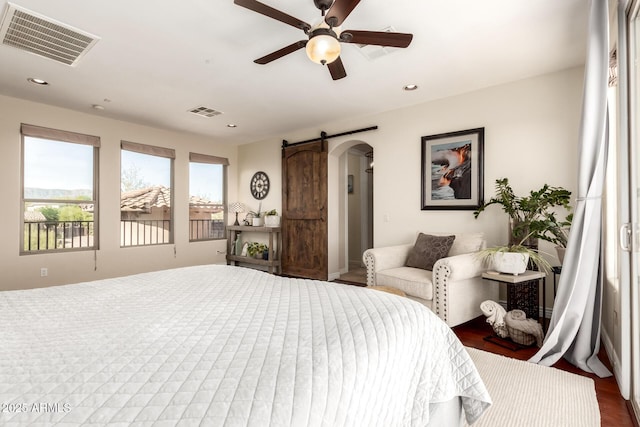 9753 E Suncrest Rd, Scottsdale, AZ 85262 - bedroom with arched walkways, recessed lighting, ceiling fan, and a barn door