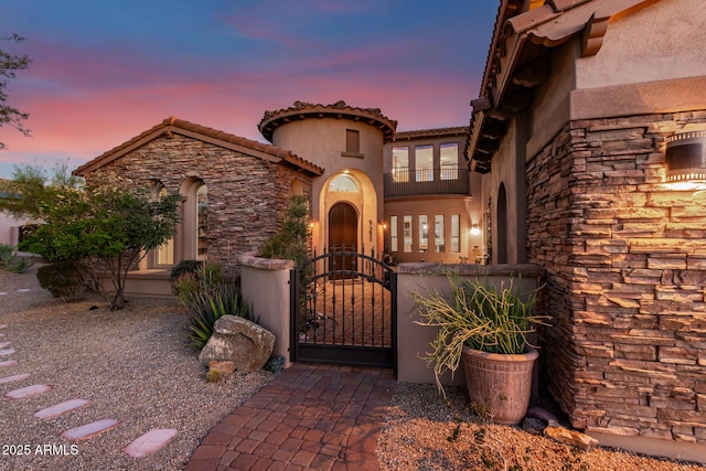 9753 E Suncrest Rd, Scottsdale, AZ 85262 - view of front facade with stucco siding, stone siding, and a gate