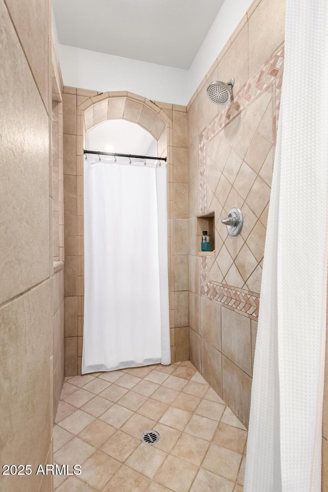 9753 E Suncrest Rd, Scottsdale, AZ 85262 - bathroom featuring a tile shower and tile patterned flooring