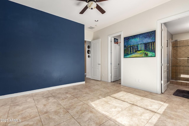 9753 E Suncrest Rd, Scottsdale, AZ 85262 - unfurnished bedroom featuring tile patterned flooring, baseboards, and ensuite bath