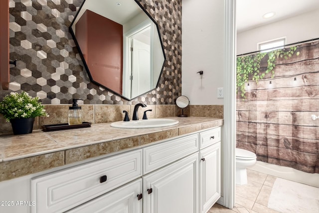 9753 E Suncrest Rd, Scottsdale, AZ 85262 - bathroom with toilet, vanity, tasteful backsplash, and tile patterned flooring