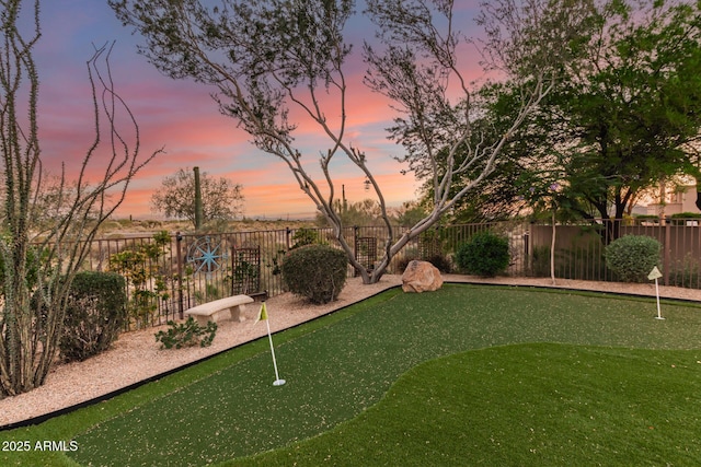 9753 E Suncrest Rd, Scottsdale, AZ 85262 - yard at dusk featuring an area to practice putting