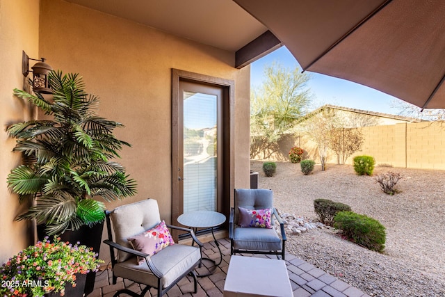 view of patio / terrace featuring fence