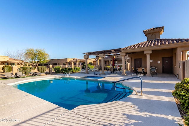 community pool with a patio area, fence, a pergola, and a residential view