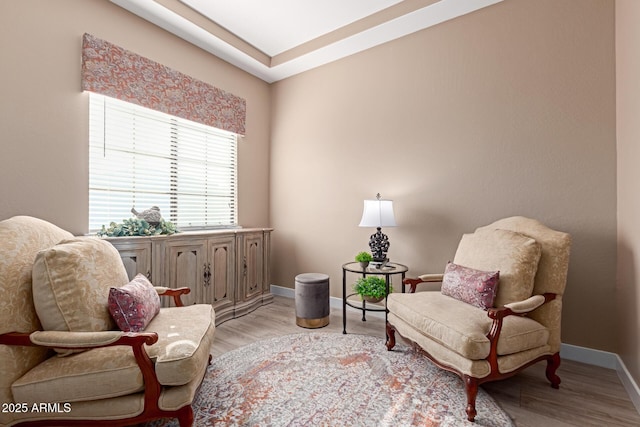 sitting room with light wood-style flooring and baseboards