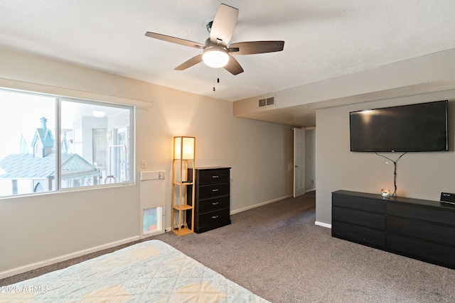 bedroom with ceiling fan and carpet flooring