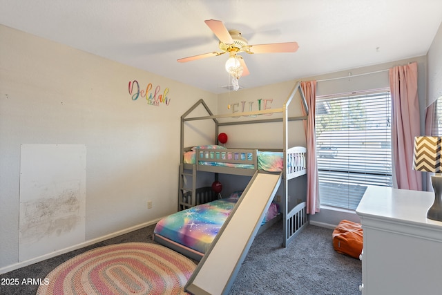 bedroom with dark colored carpet and ceiling fan