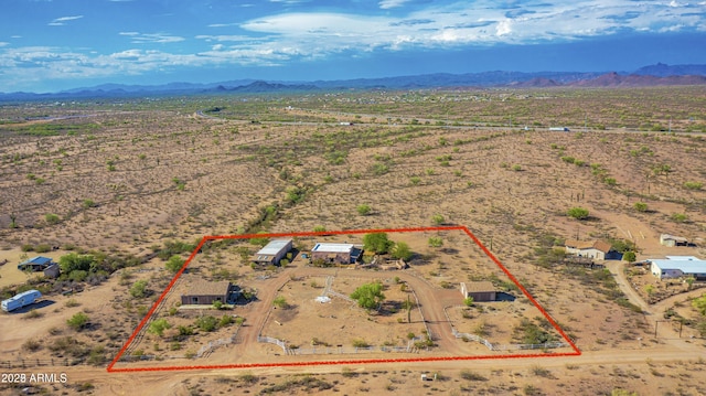 aerial view with a mountain view, a rural view, and a desert view